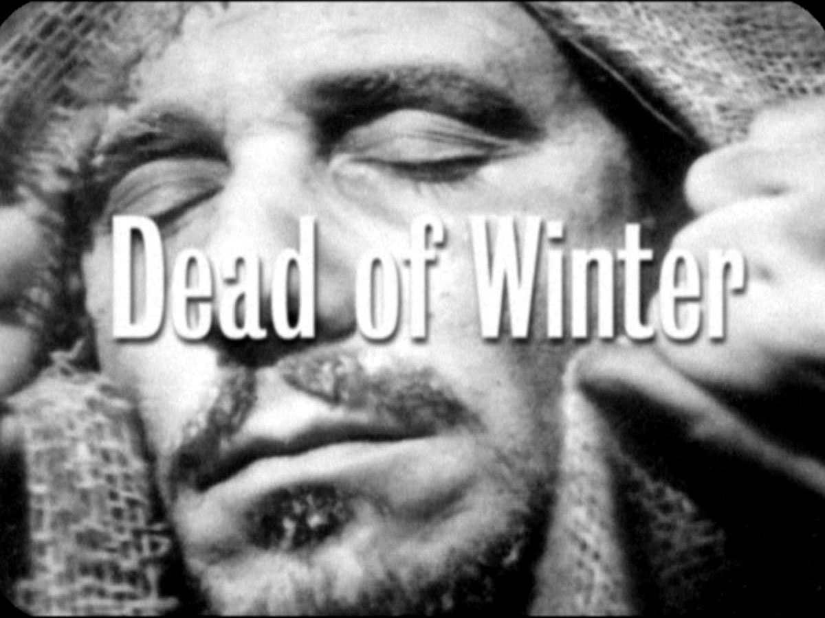 title card: Dead of Winter superimposed on the frozen face of Schneider ...