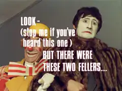 title card: white all caps text reading ‘LOOK - (stop me if you’ve heard this one) BUT There Were These Two Fellers…’ superimposed on Maxie and Jennings in their clown make-up. Maxie is smiling inanely while Jennings has a sad face